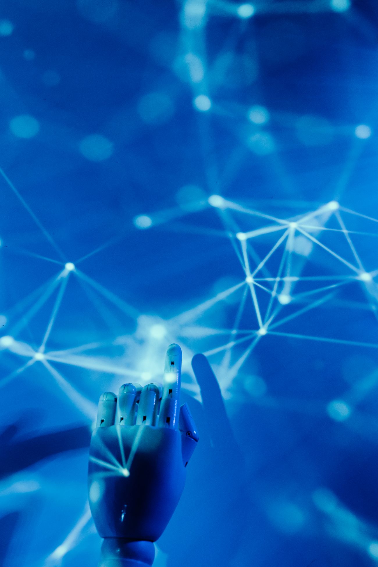 Robotic hand reaching into a digital network, representing AI-driven marketing automation